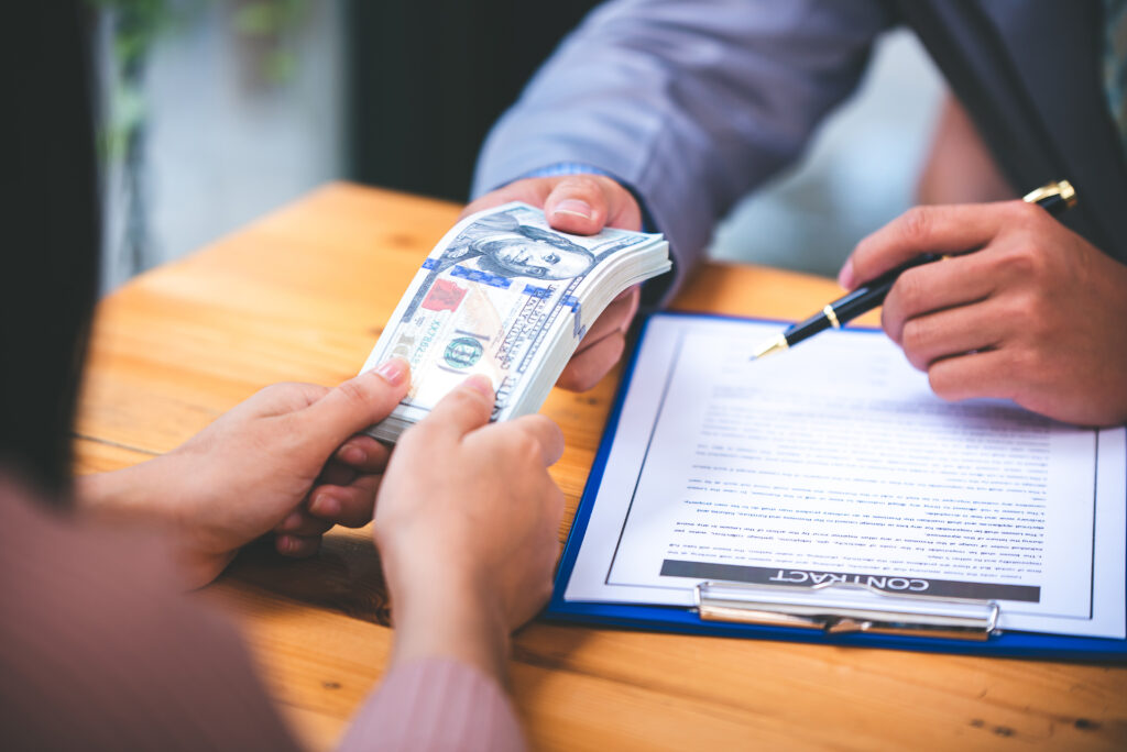 business people negotiating contracts With the papers on the table and the contract signing in the morning